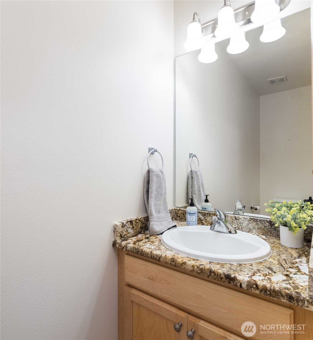1182 Decatur Circle, Unit 7A Burlington, WA 98233 - Photo 31 of 36 a bathroom with a granite countertop sink and a mirror