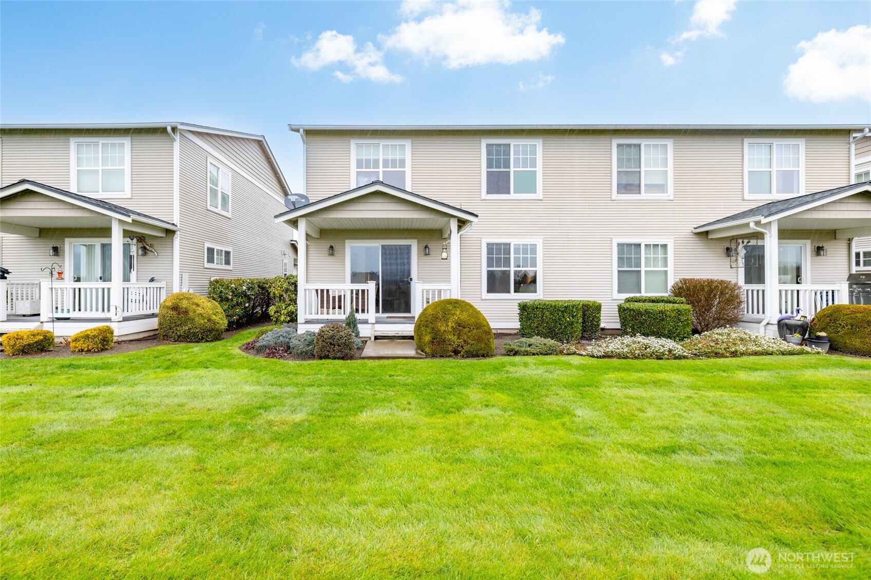 1182 Decatur Circle, Unit 7A Burlington, WA 98233 - Photo 34 of 36 a front view of a house with a yard