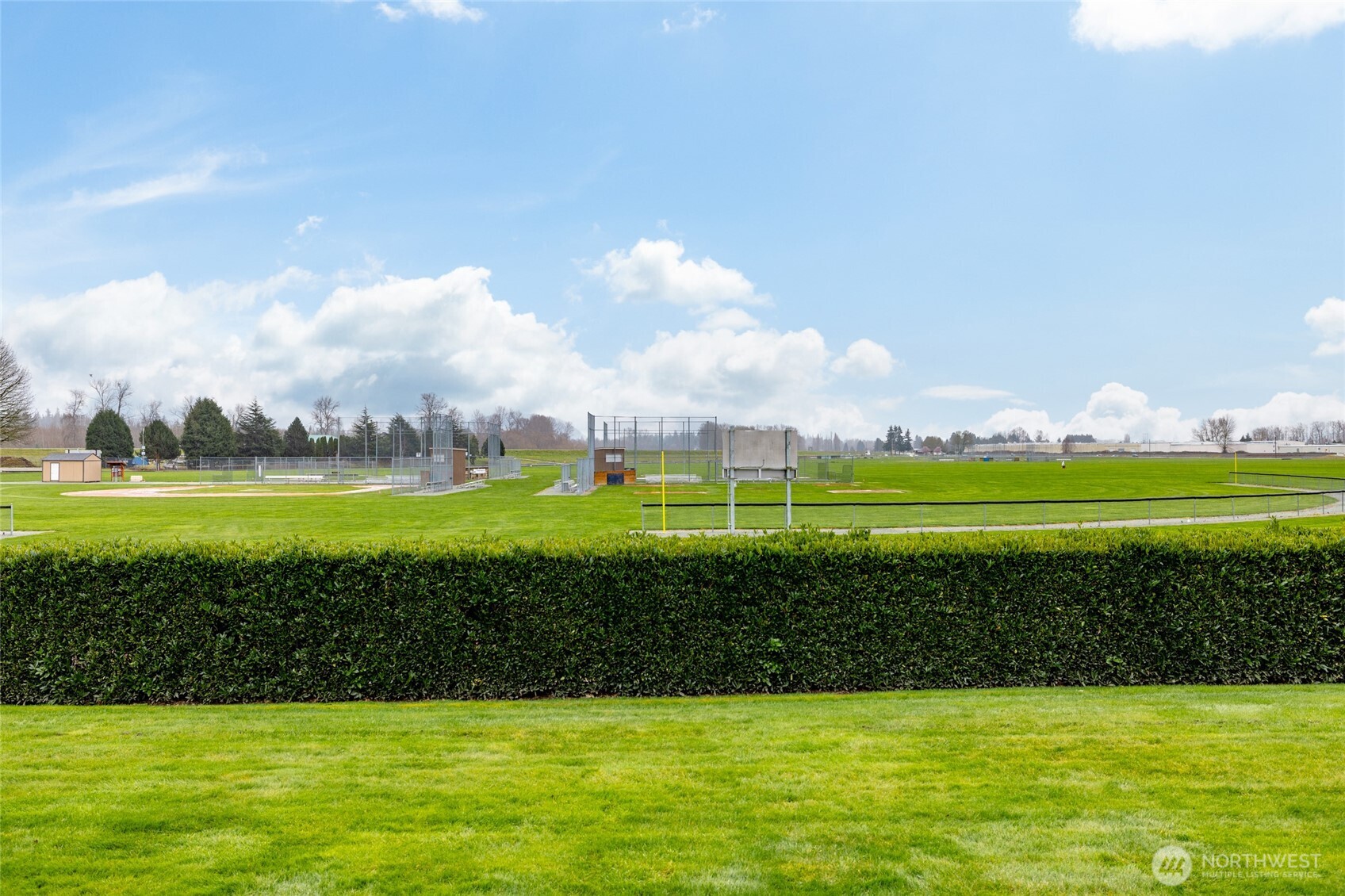1182 Decatur Circle, Unit 7A Burlington, WA 98233 - Photo 35 of 36 a view of a golf course with a lake
