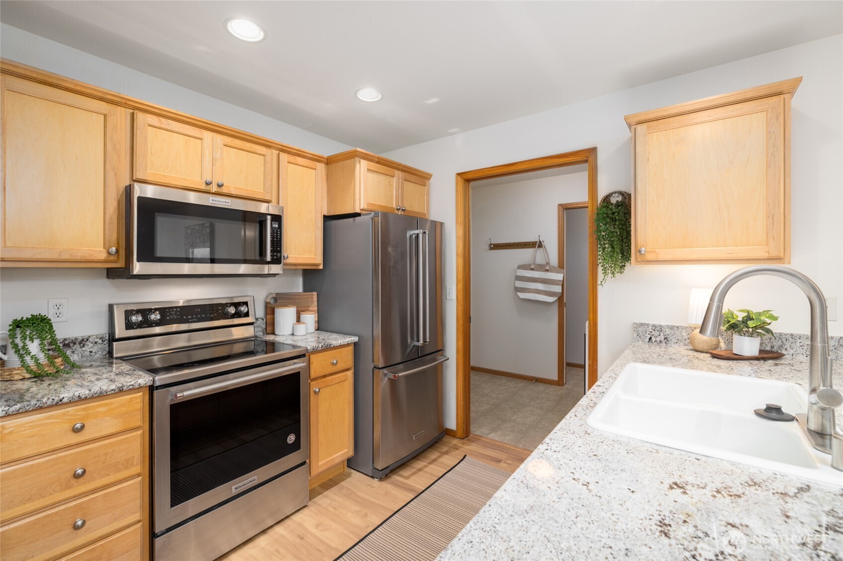1182 Decatur Circle, Unit 7A Burlington, WA 98233 - Photo 7 of 36 a kitchen with stainless steel appliances granite countertop a refrigerator and a stove top oven