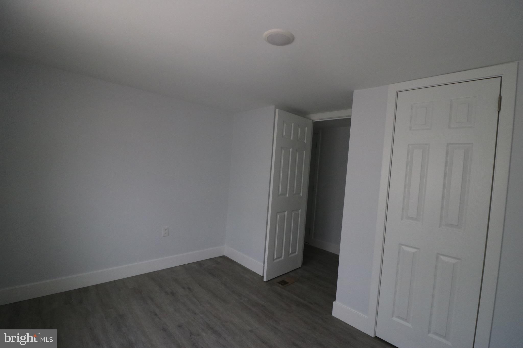 121 Bengies Road Middle River, MD 21220 - Photo 2 of 6 a view of an empty room with wooden floor