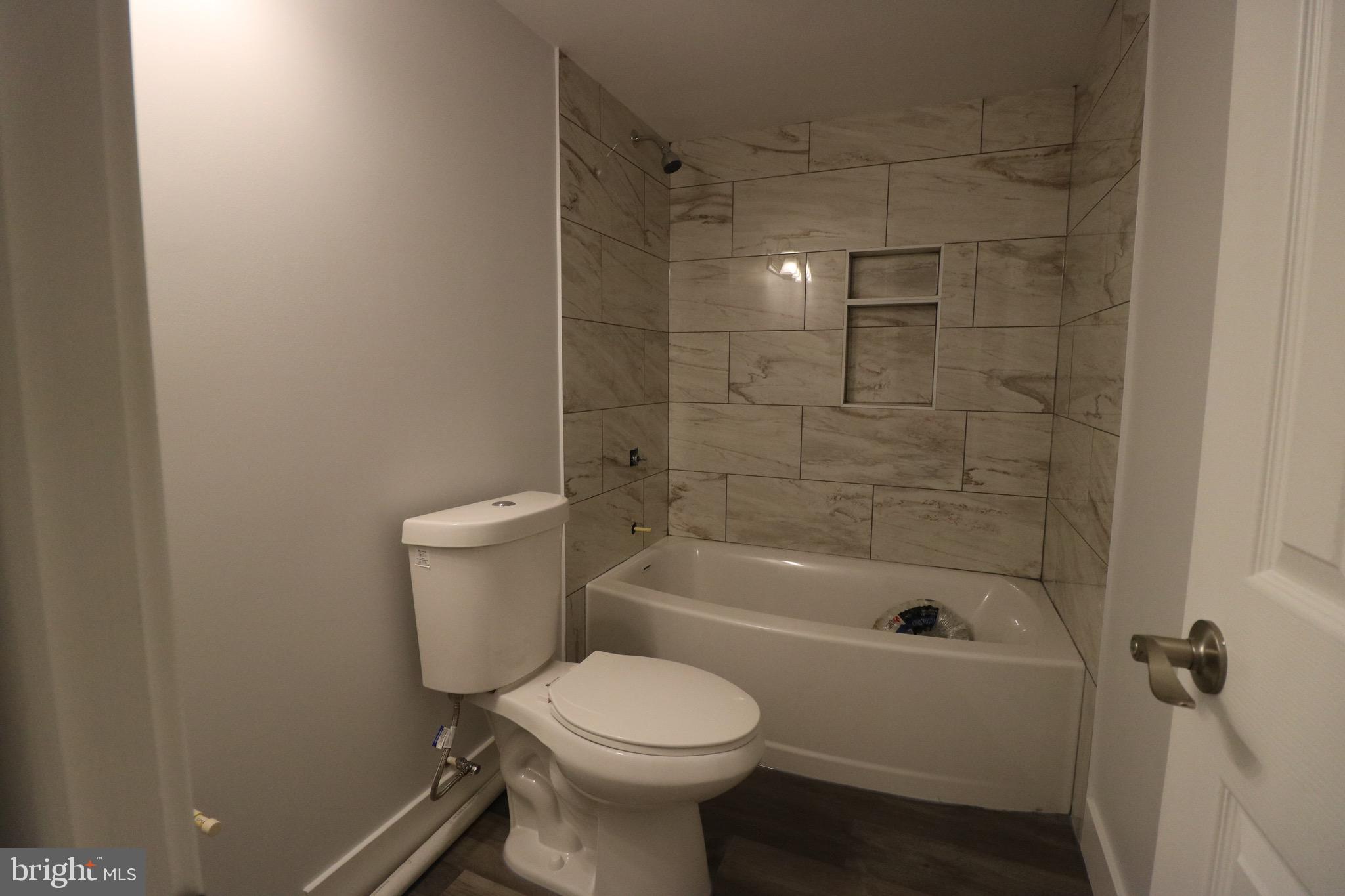 121 Bengies Road Middle River, MD 21220 - Photo 5 of 6 a bathroom with a sink toilet and shower