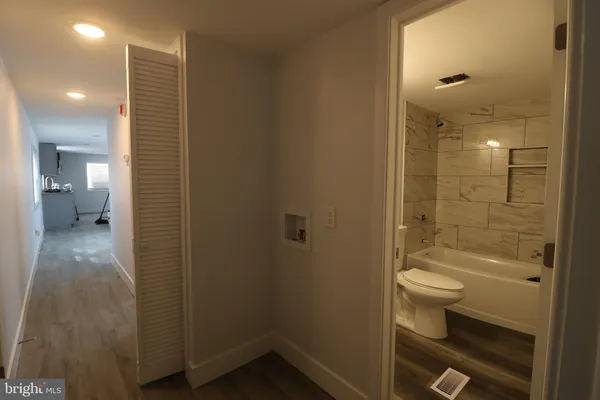 a bathroom with a shower and a toilet