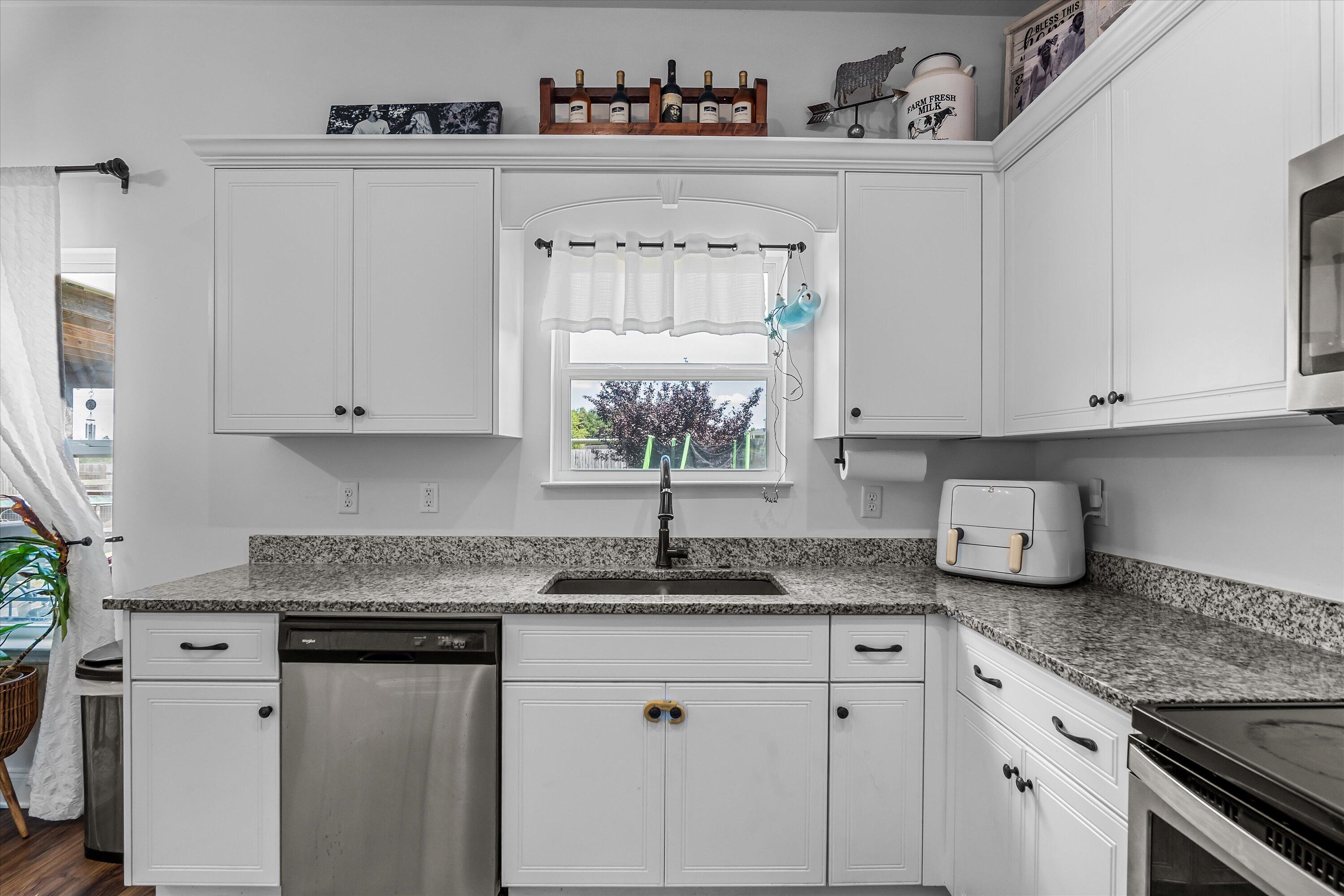 125 Macedonia Road North Augusta, SC 29860 - Photo 12 of 41 Granite Countertops and a sink that overlooks the large backyard