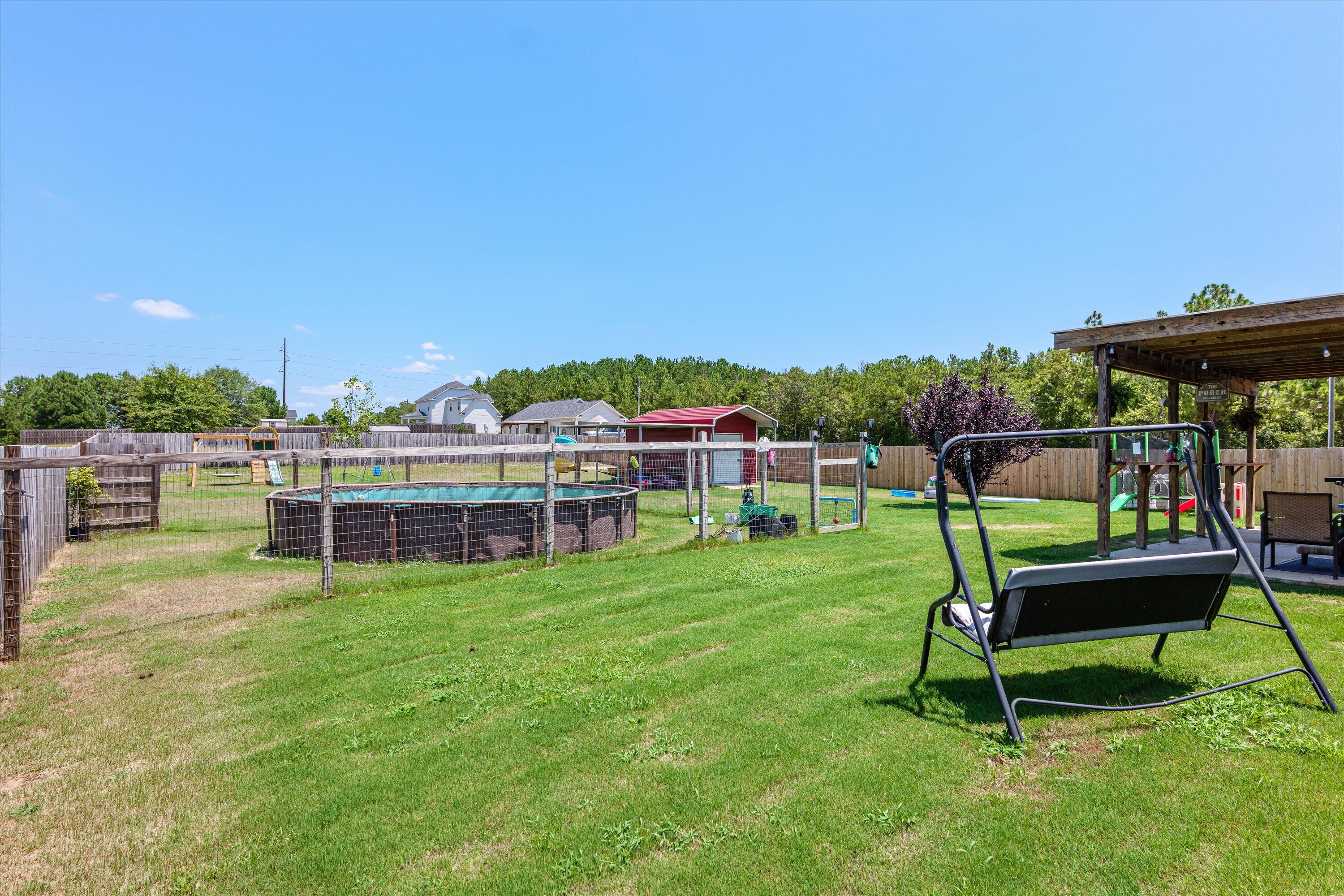 125 Macedonia Road North Augusta, SC 29860 - Photo 26 of 41 Over half an acre of space! Yard is privacy fenced with additional fenced area for the above ground pool. Yard provides AMPLE space for your backyard dreams.