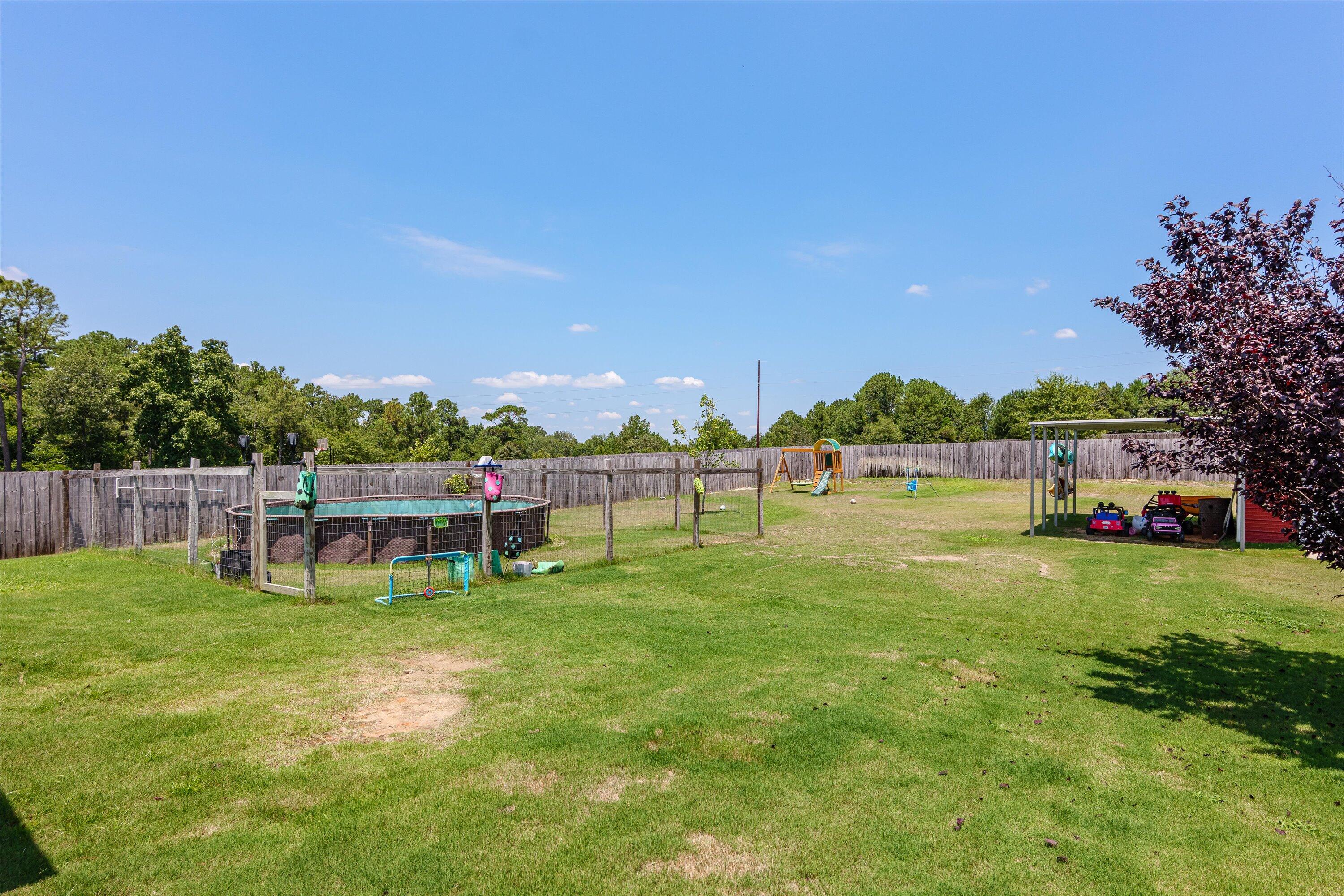 125 Macedonia Road North Augusta, SC 29860 - Photo 28 of 41 Over half an acre of space! Yard is privacy fenced with additional fenced area for the above ground pool. Yard provides AMPLE space for your backyard dreams.