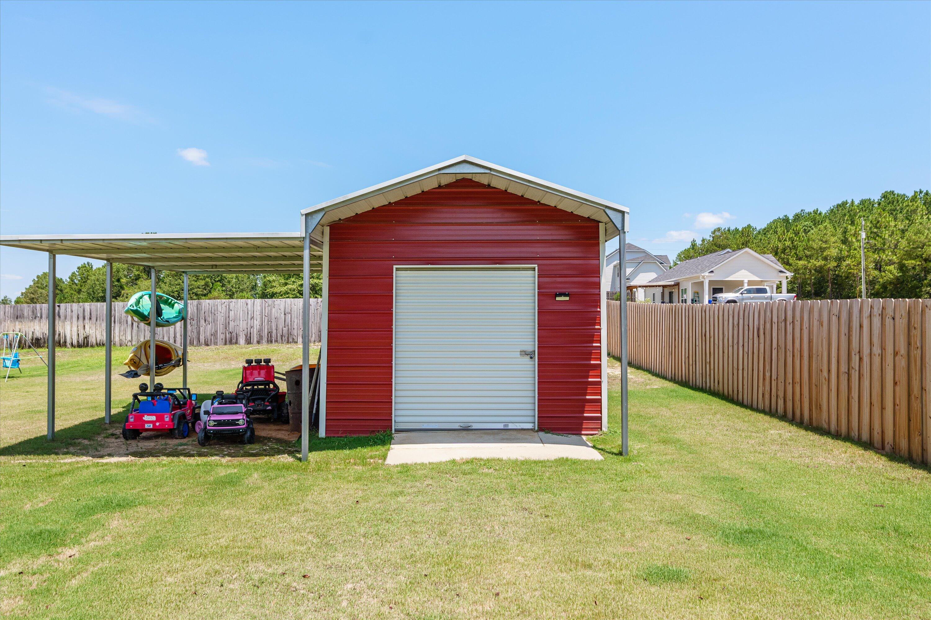 125 Macedonia Road North Augusta, SC 29860 - Photo 32 of 41 Over half an acre of space! Yard is privacy fenced with additional fenced area for the above ground pool. Yard provides AMPLE space for your backyard dreams.