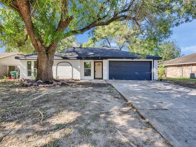 a house with a tree in front of it