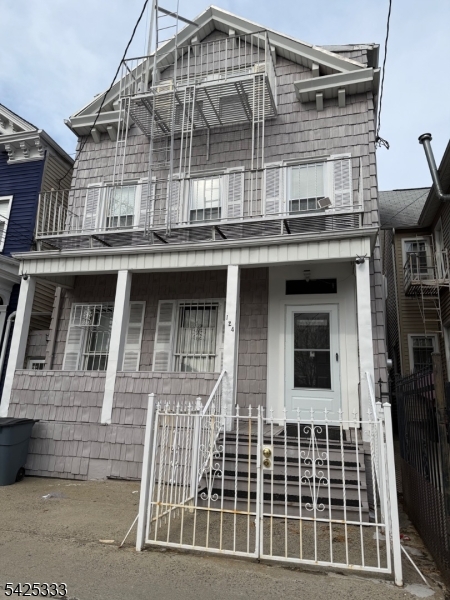 124 Stone Street, Unit 3 Newark, NJ 07104 - Photo 1 of 10 front view of a building