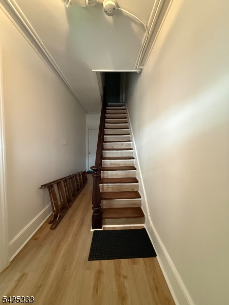 124 Stone Street, Unit 3 Newark, NJ 07104 - Photo 10 of 10 a view of entryway and hall with wooden floor