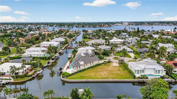 an aerial view of a residential houses with outdoor space