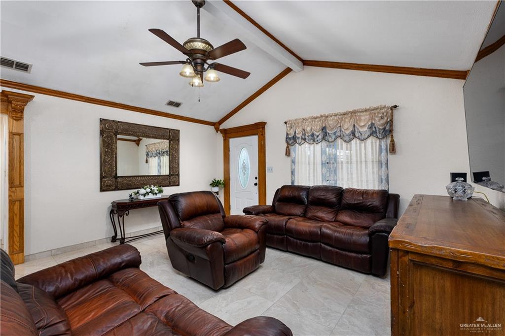 118 J R Becerra Avenue Progreso, TX 78596 - Photo 2 of 17 a living room with furniture