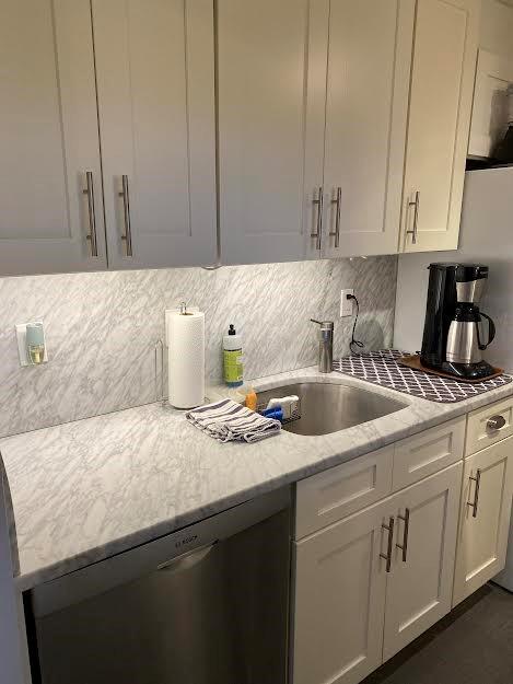 1270 North Avenue, Unit 3C New Rochelle, NY 10804 - Photo 1 of 1 a kitchen with granite countertop a sink a stove and cabinets