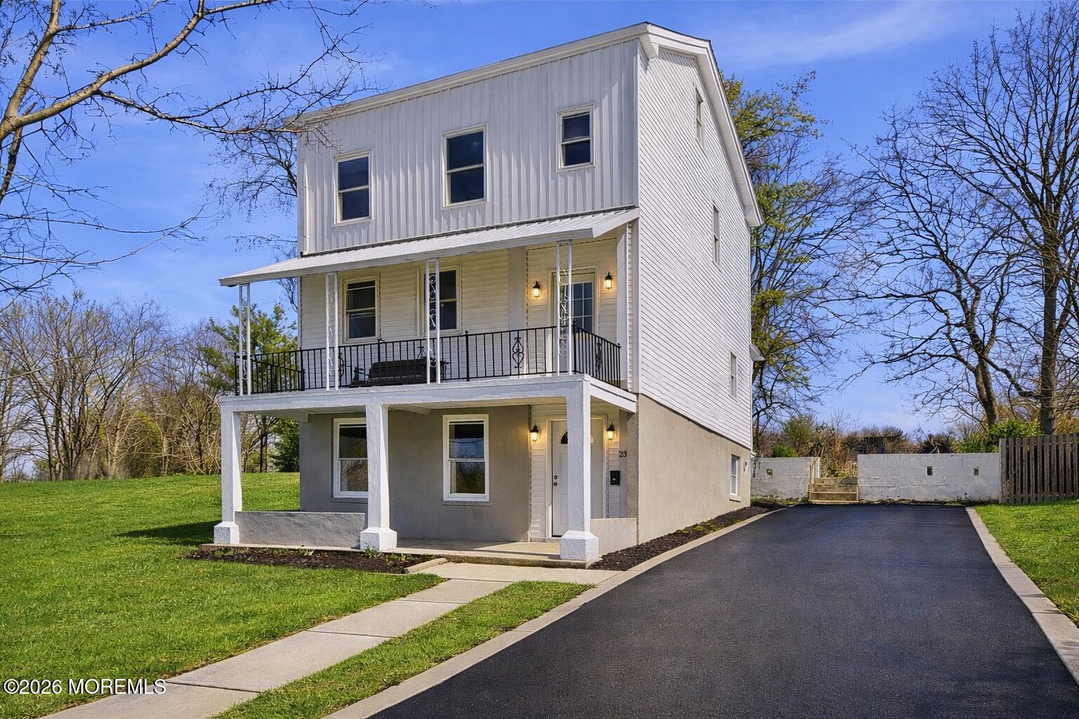 23 Beers Street Keyport, NJ 07735 - Photo 1 of 51 a view of a white house with a big yard and large tree