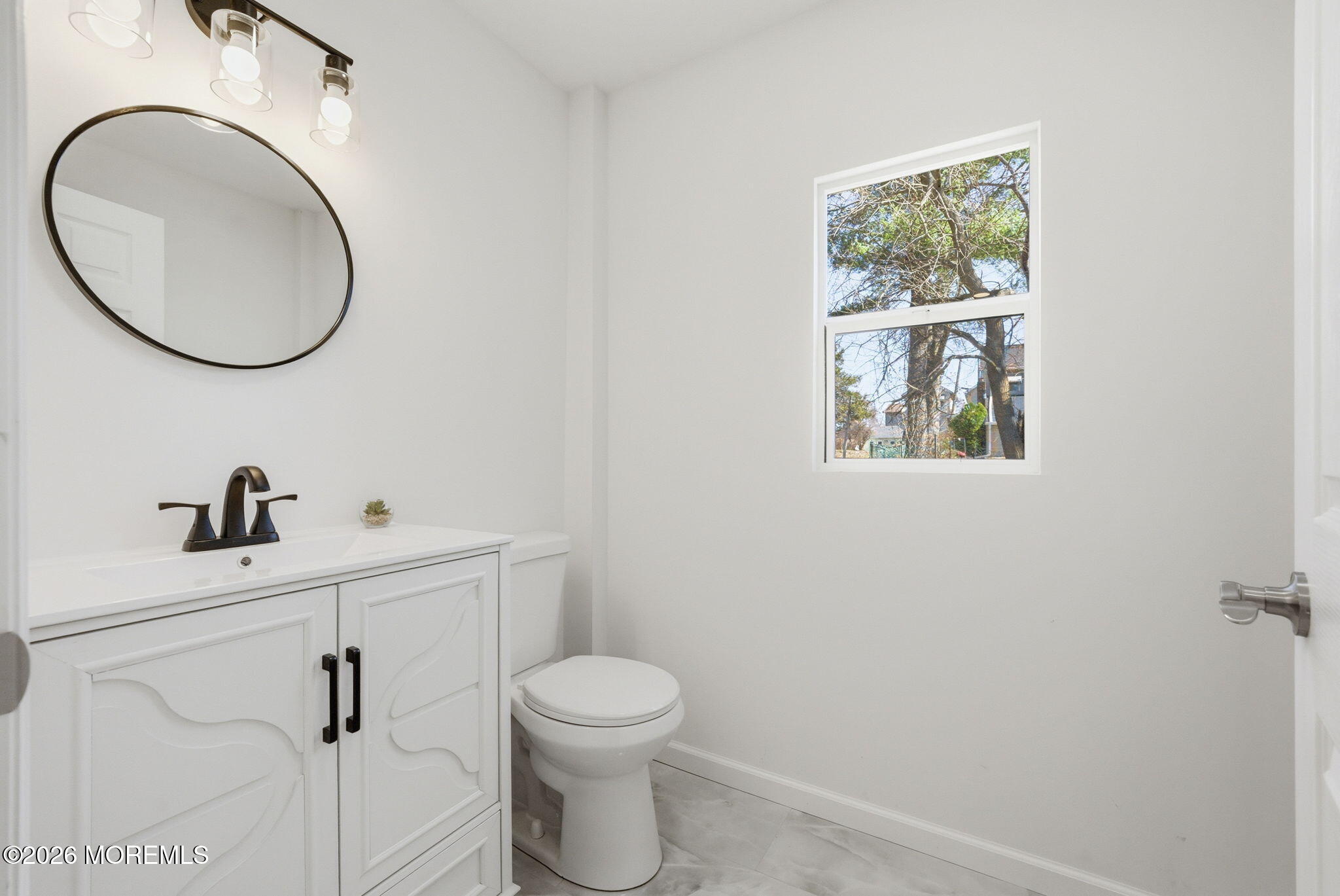23 Beers Street Keyport, NJ 07735 - Photo 13 of 51 a bathroom with a toilet a sink and mirror