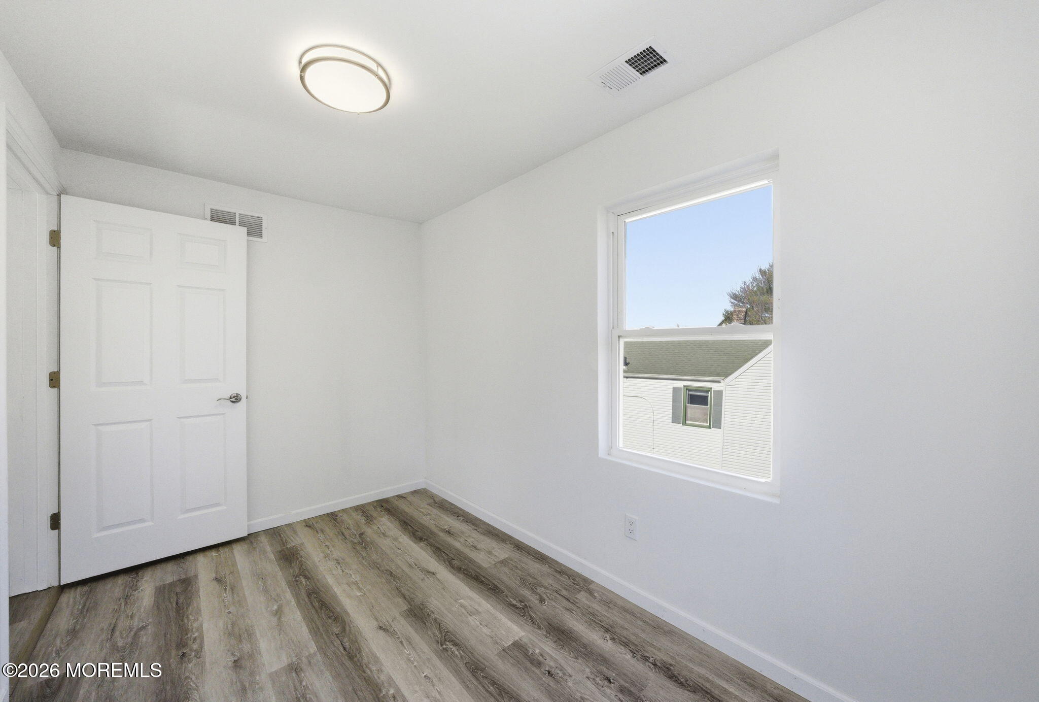 23 Beers Street Keyport, NJ 07735 - Photo 22 of 51 a view of a small space with wooden floor and a window