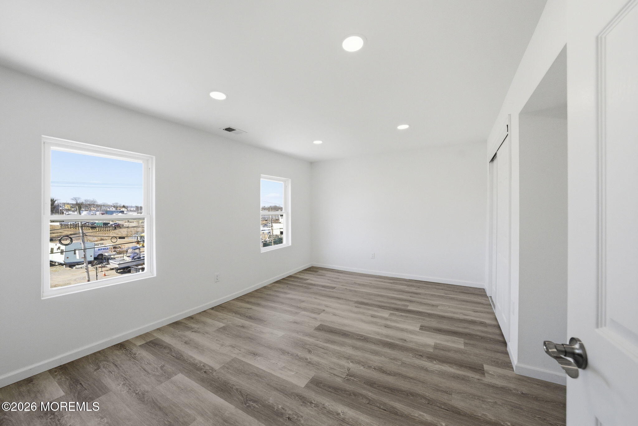 23 Beers Street Keyport, NJ 07735 - Photo 23 of 51 a view of an empty room with wooden floor and a window