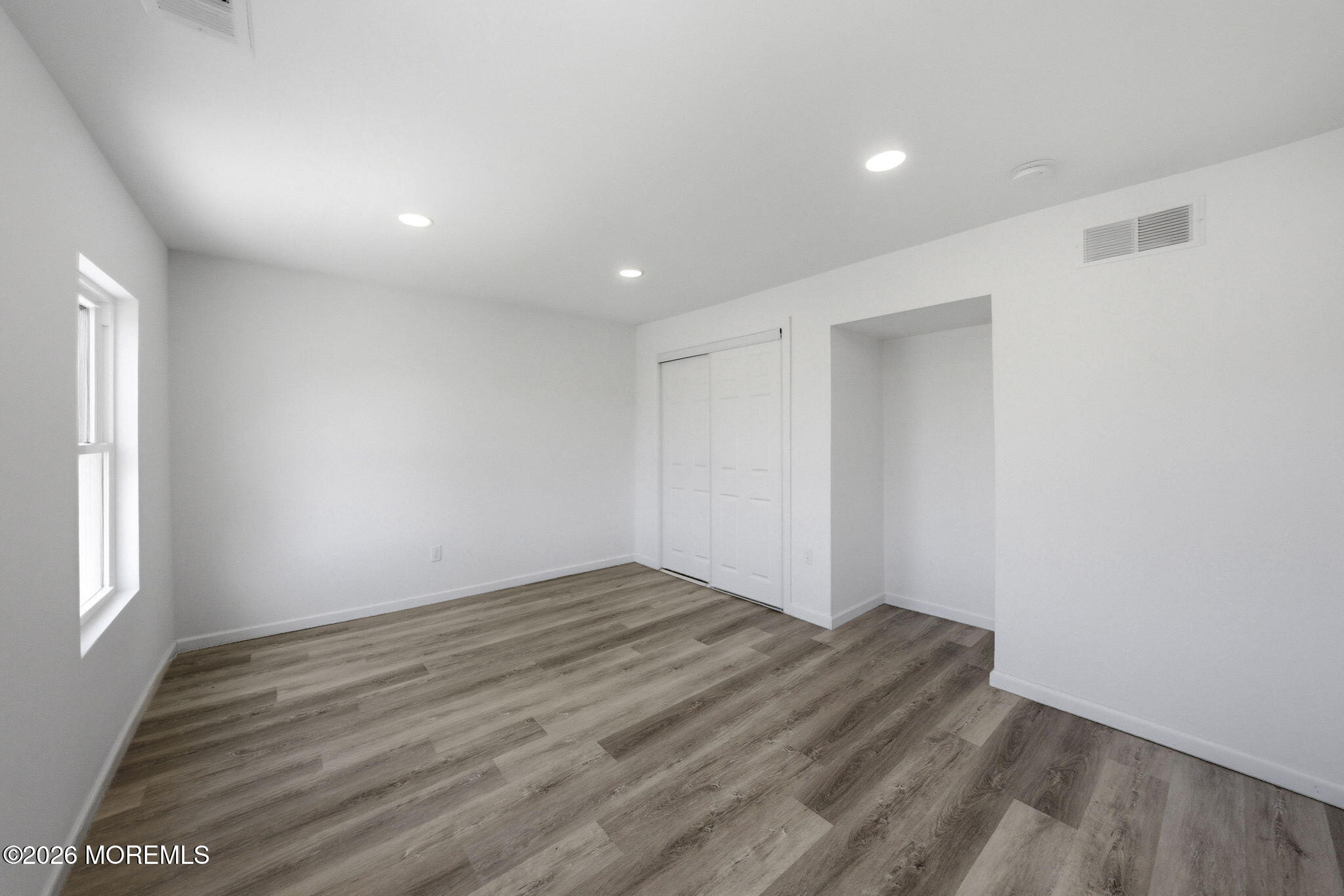 23 Beers Street Keyport, NJ 07735 - Photo 24 of 51 wooden floor in an empty room with a window