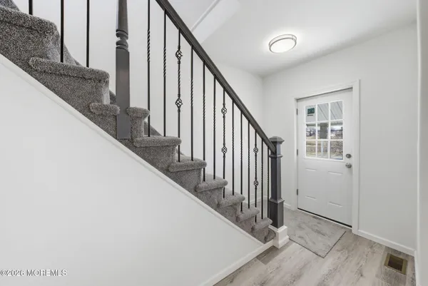 a view of staircase with wooden floor and staircase