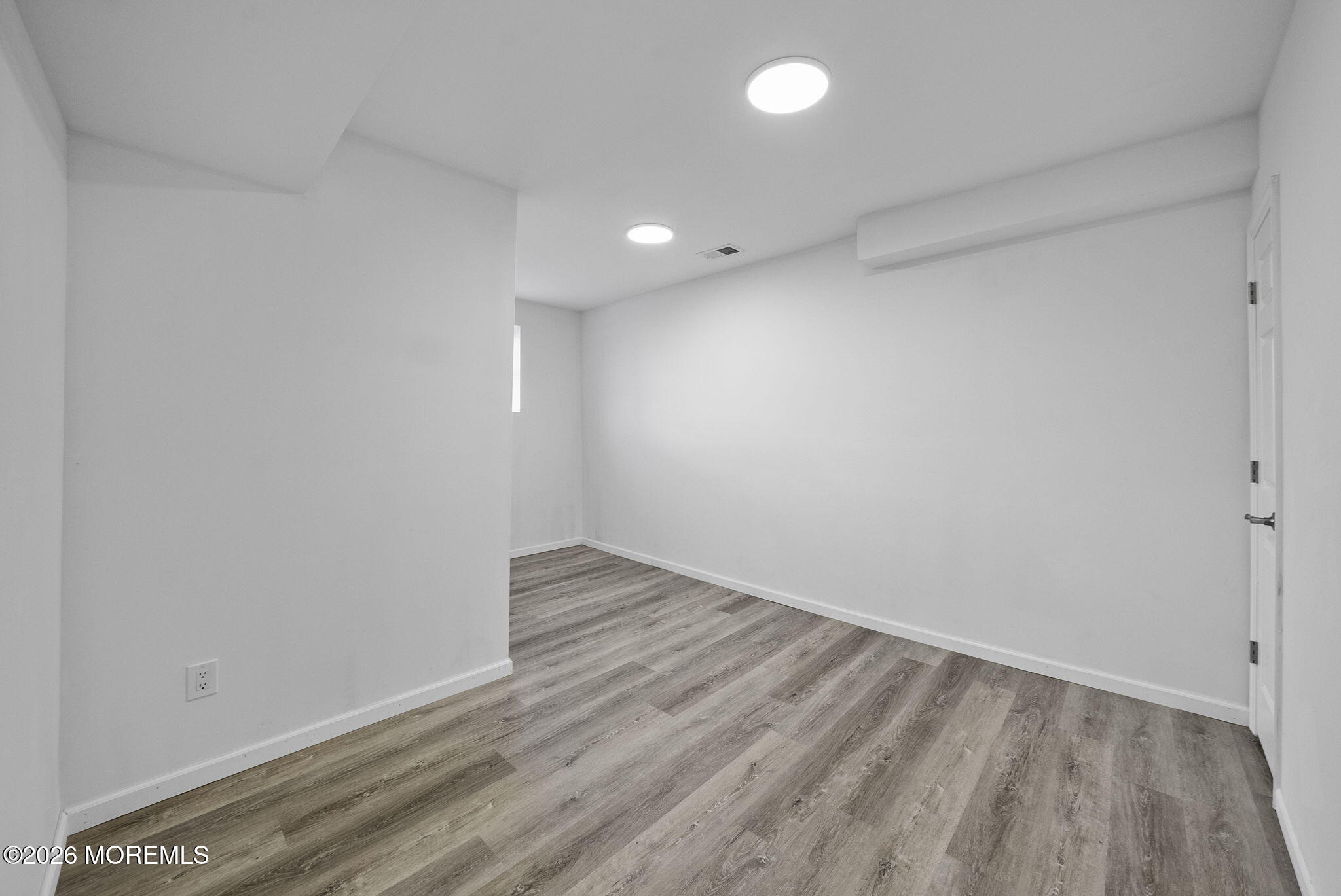 23 Beers Street Keyport, NJ 07735 - Photo 38 of 51 a view of an empty room with wooden floor