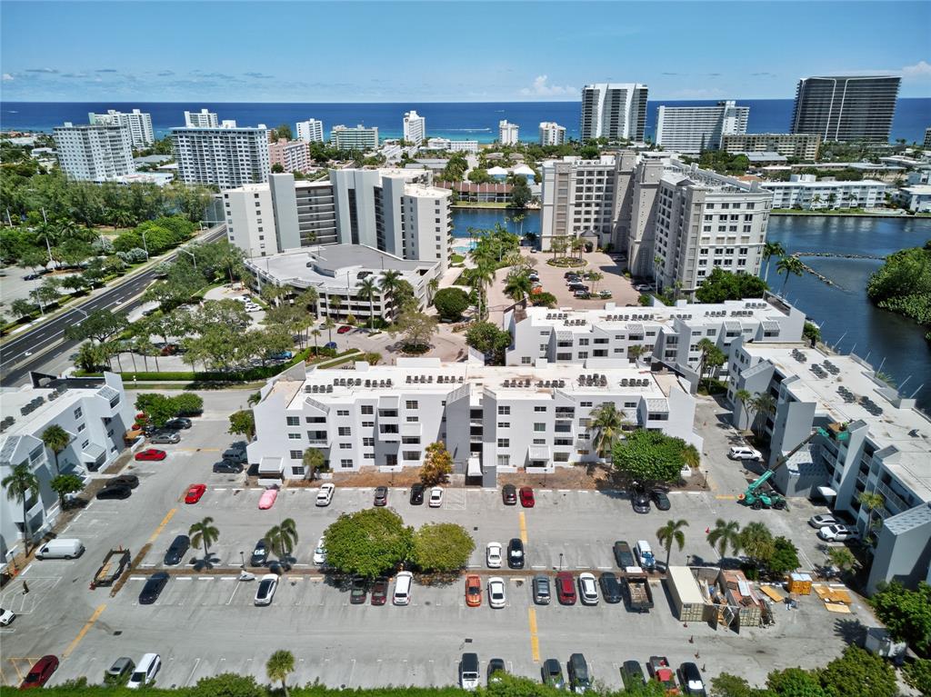 2850 Northeast 14th Street, Unit 410B Pompano Beach, FL 33062 - Photo 1 of 25 a view of building with outdoor space and seating space