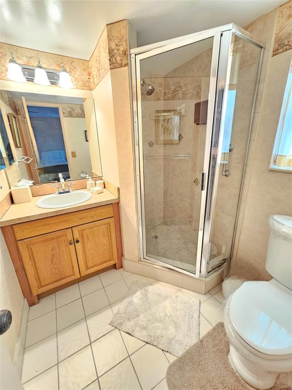 2850 Northeast 14th Street, Unit 410B Pompano Beach, FL 33062 - Photo 11 of 25 a bathroom with a sink toilet and shower