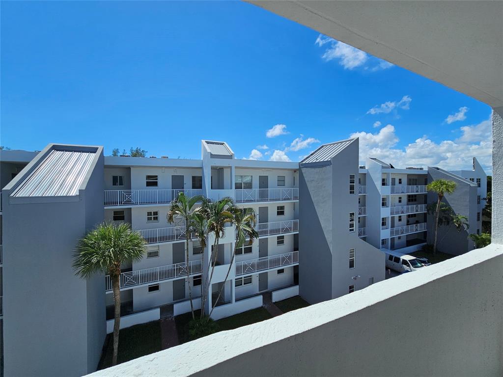 2850 Northeast 14th Street, Unit 410B Pompano Beach, FL 33062 - Photo 12 of 25 a view of a house with yard and sitting area