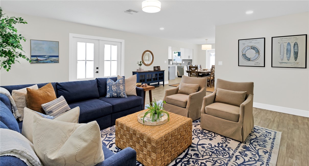 7989 143rd Street Sebastian, FL 32958 - Photo 4 of 30 a living room with furniture and a mirror
