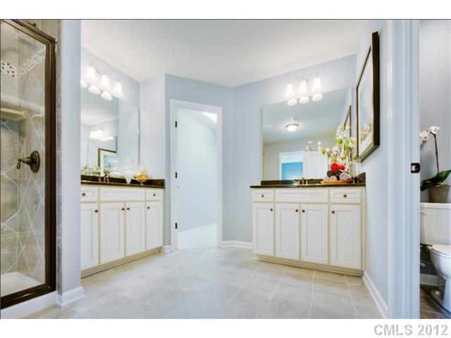 1444 Ridgehaven Road, Unit 146 Waxhaw, NC 28173 - Photo 9 of 16 a bathroom with a sink vanity and a mirror