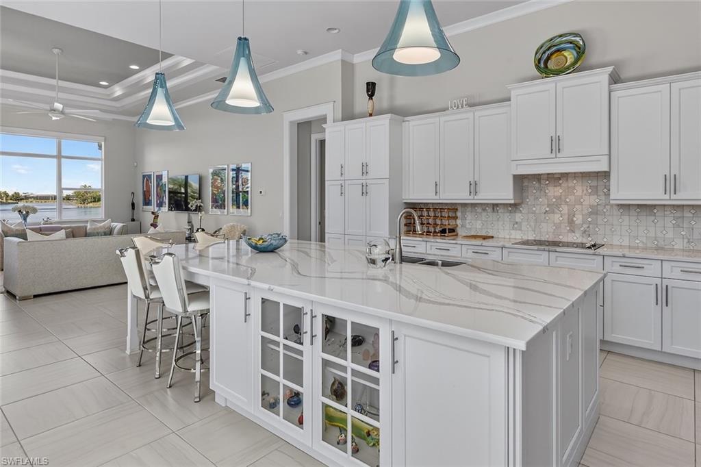 6387 Warwick Avenue Naples, FL 34113 - Photo 12 of 40 Kitchen with beautiful pendant lights