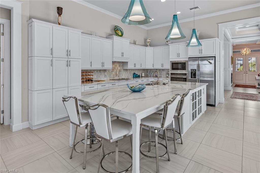 6387 Warwick Avenue Naples, FL 34113 - Photo 13 of 40 Kitchen, extended island creating eat in kitchen and expansive island