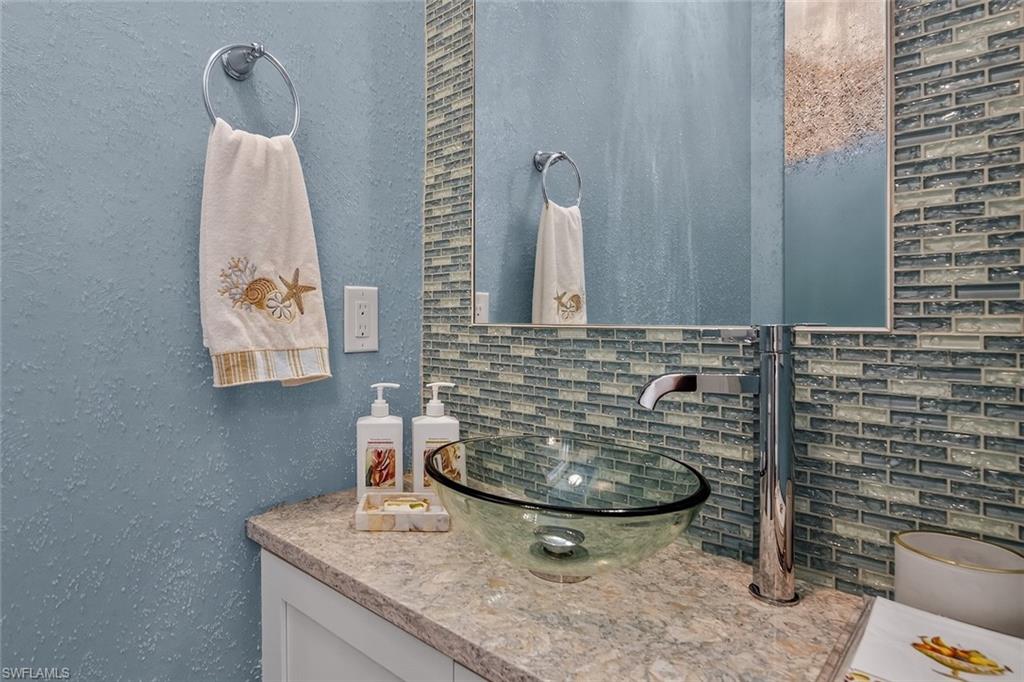 6387 Warwick Avenue Naples, FL 34113 - Photo 19 of 40 Powder Room with crystal textured wallpaper