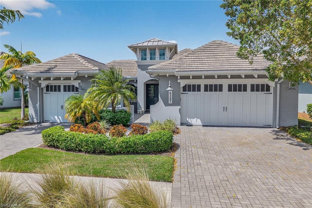 6387 Warwick Avenue Naples, FL 34113 - Photo 2 of 40 View of front of home with 3 car garage