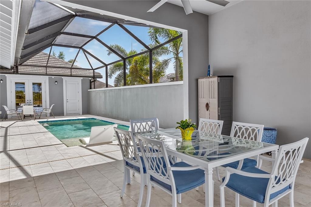 6387 Warwick Avenue Naples, FL 34113 - Photo 31 of 40 Heated swimming pool with courtyard wall for maximum privacy