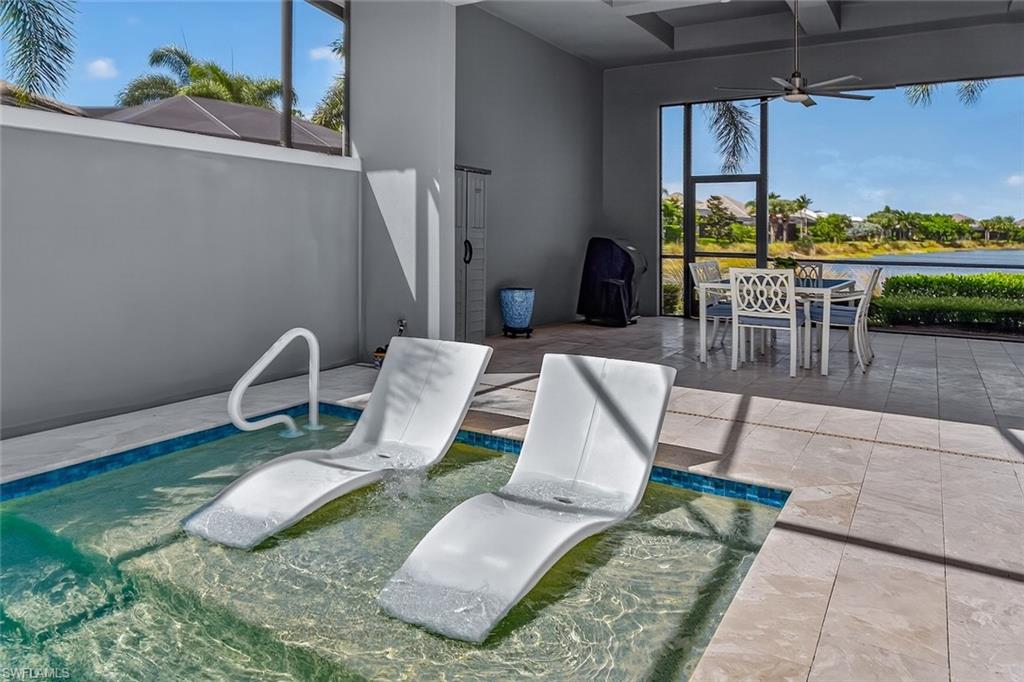 6387 Warwick Avenue Naples, FL 34113 - Photo 33 of 40 Heated swimming pool, with sunshelf