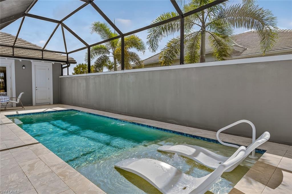 6387 Warwick Avenue Naples, FL 34113 - Photo 35 of 40 Heated swimming pool, with sunshelf