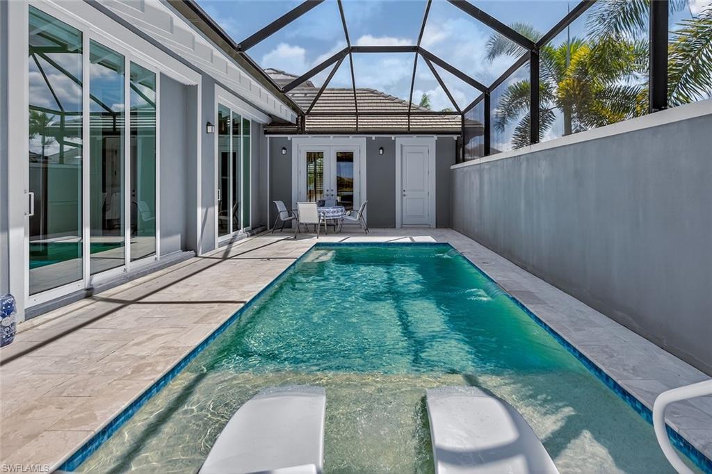 6387 Warwick Avenue Naples, FL 34113 - Photo 36 of 40 Heated swimming pool, with sun shelf
