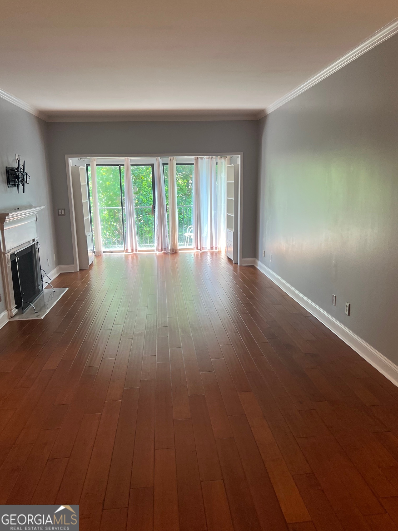 3071 Lenox Road Northeast, Unit 39 Atlanta, GA 30324 - Photo 16 of 29 wooden floor in an empty room with a window