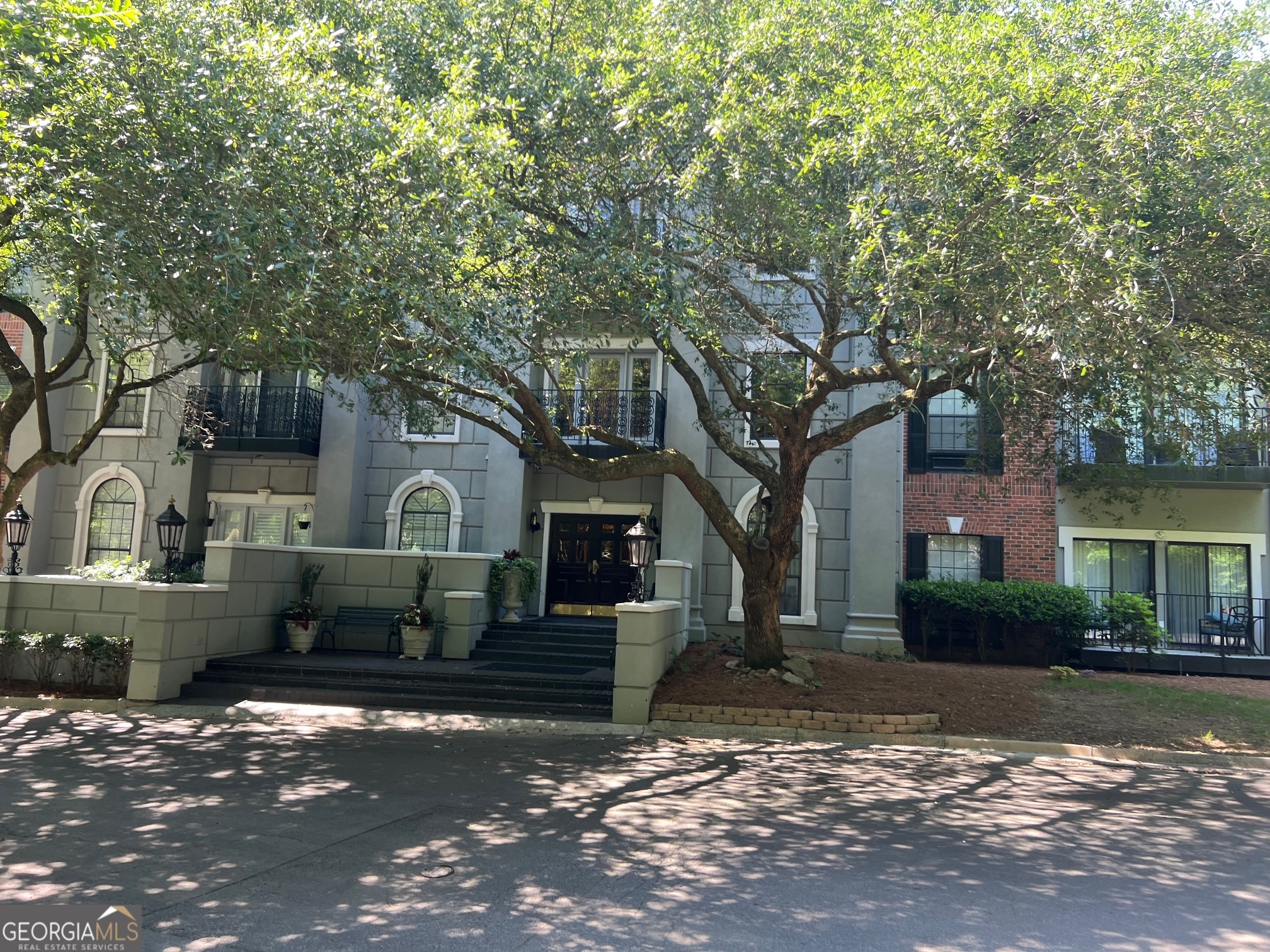 3071 Lenox Road Northeast, Unit 39 Atlanta, GA 30324 - Photo 5 of 29 a front view of a house with a yard