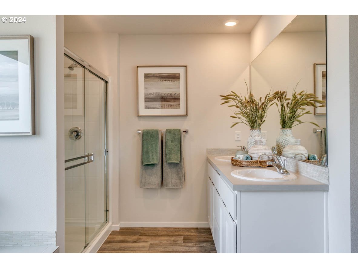2791 U Street Springfield, OR 97477 - Photo 26 of 29 a bathroom with a sink mirror and vanity