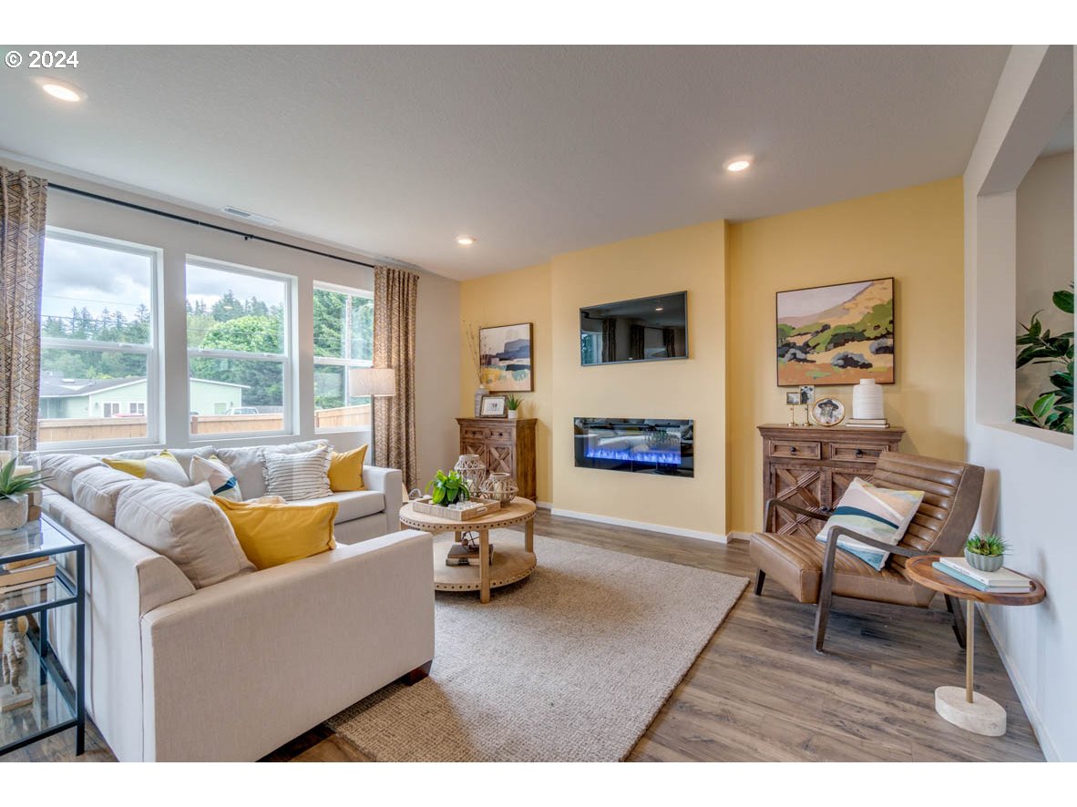 2791 U Street Springfield, OR 97477 - Photo 8 of 29 a living room with furniture and a fireplace