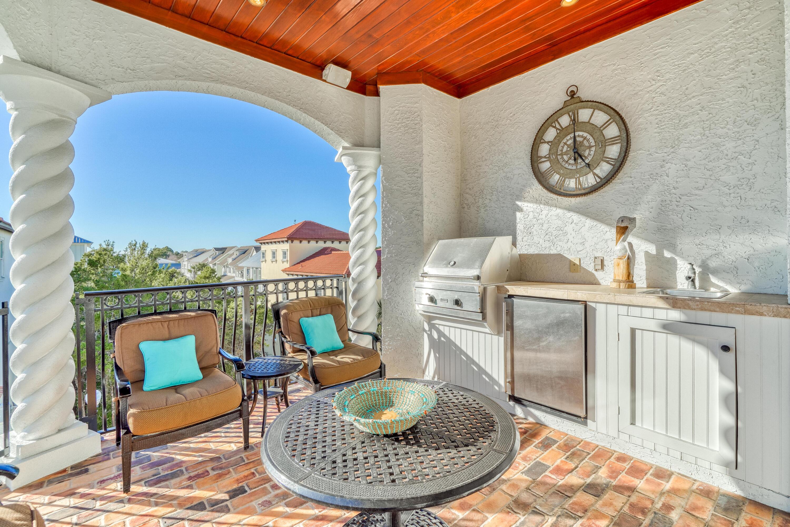 89 Palmeira Way Santa Rosa Beach, FL 32459 - Photo 19 of 64 a living room with furniture a clock and a rug