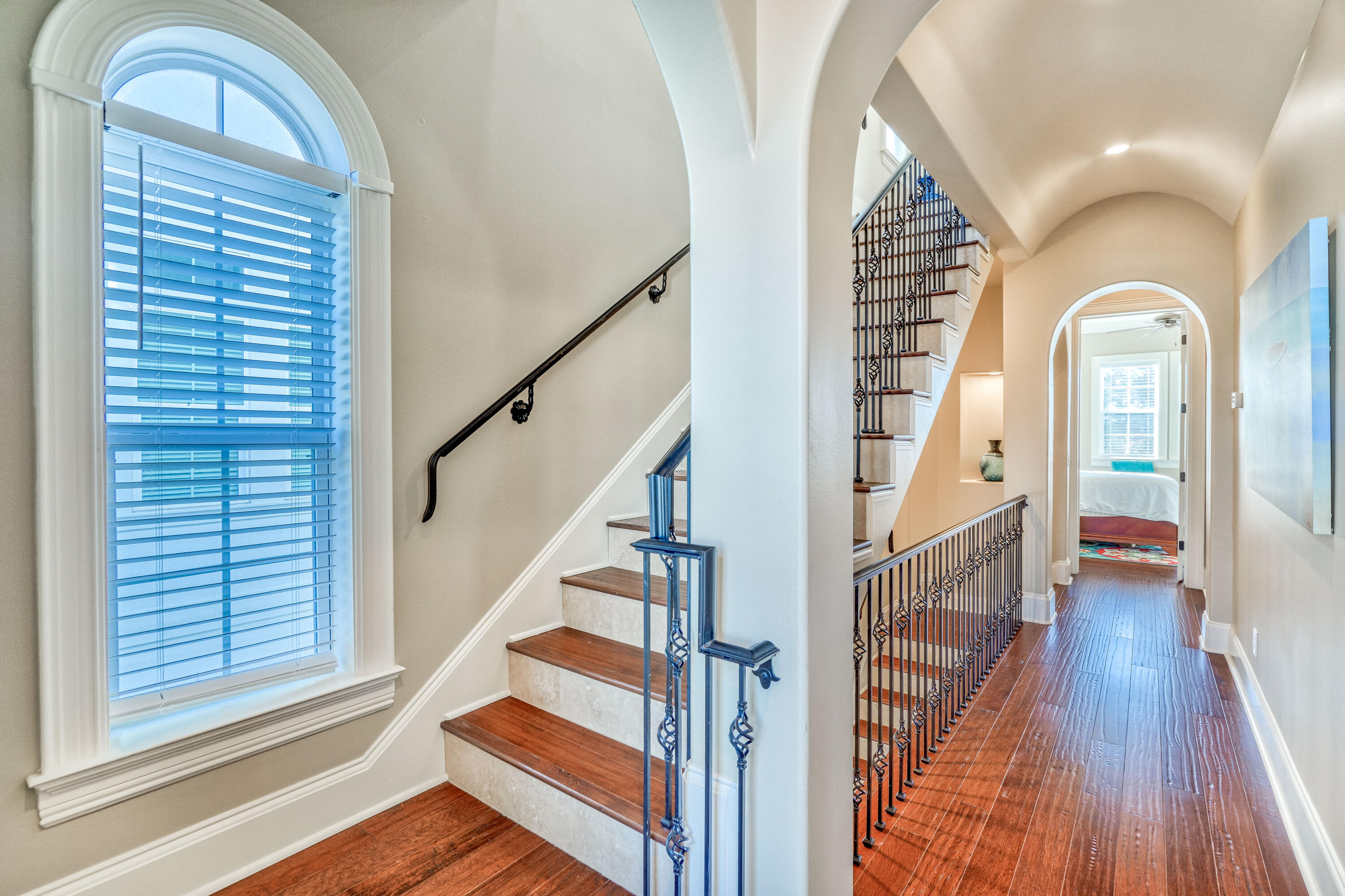 89 Palmeira Way Santa Rosa Beach, FL 32459 - Photo 21 of 64 a view of staircase with wooden floor and a large window