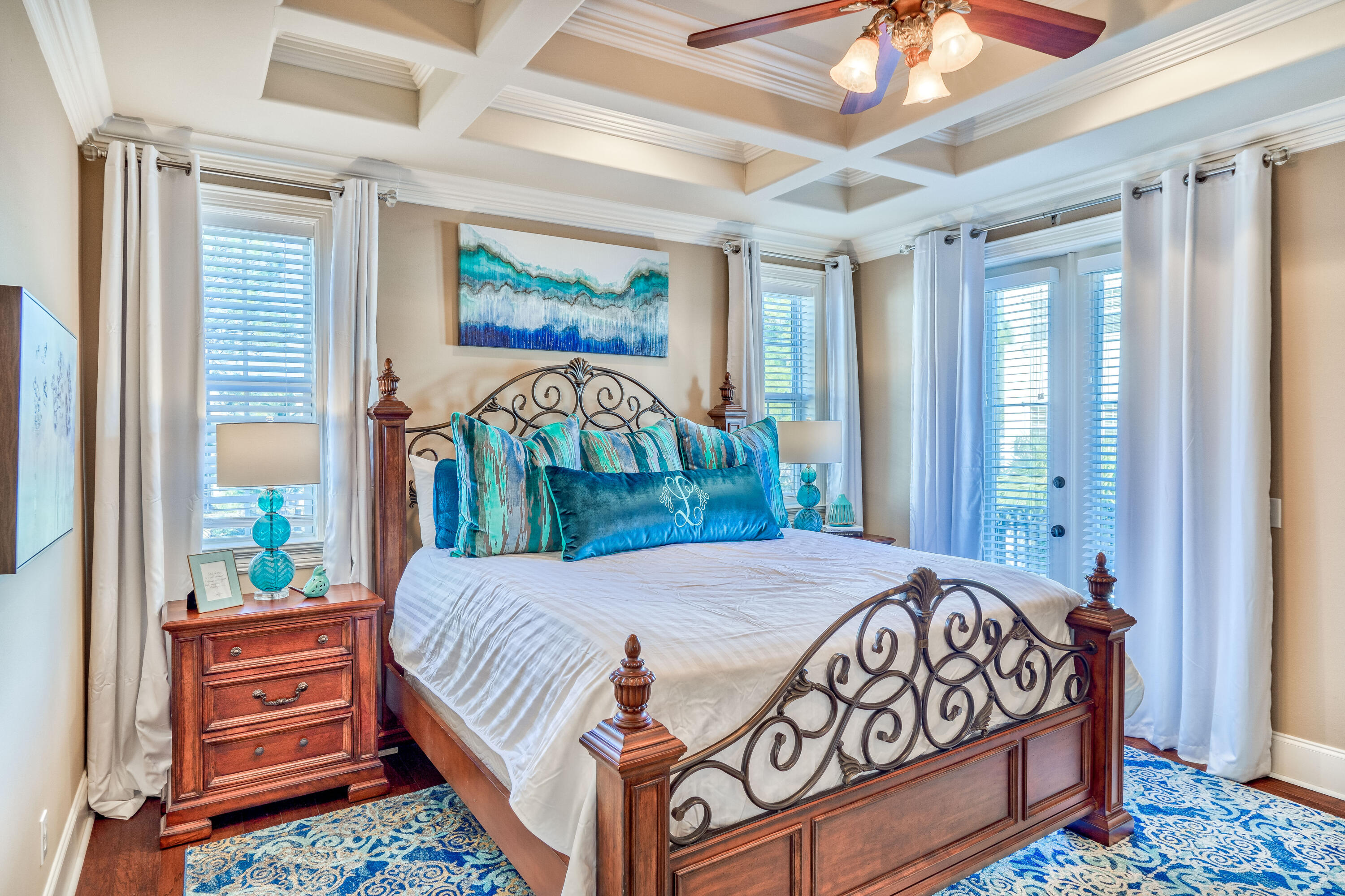 89 Palmeira Way Santa Rosa Beach, FL 32459 - Photo 23 of 64 a bedroom with a bed a dresser and a large mirror next to a window