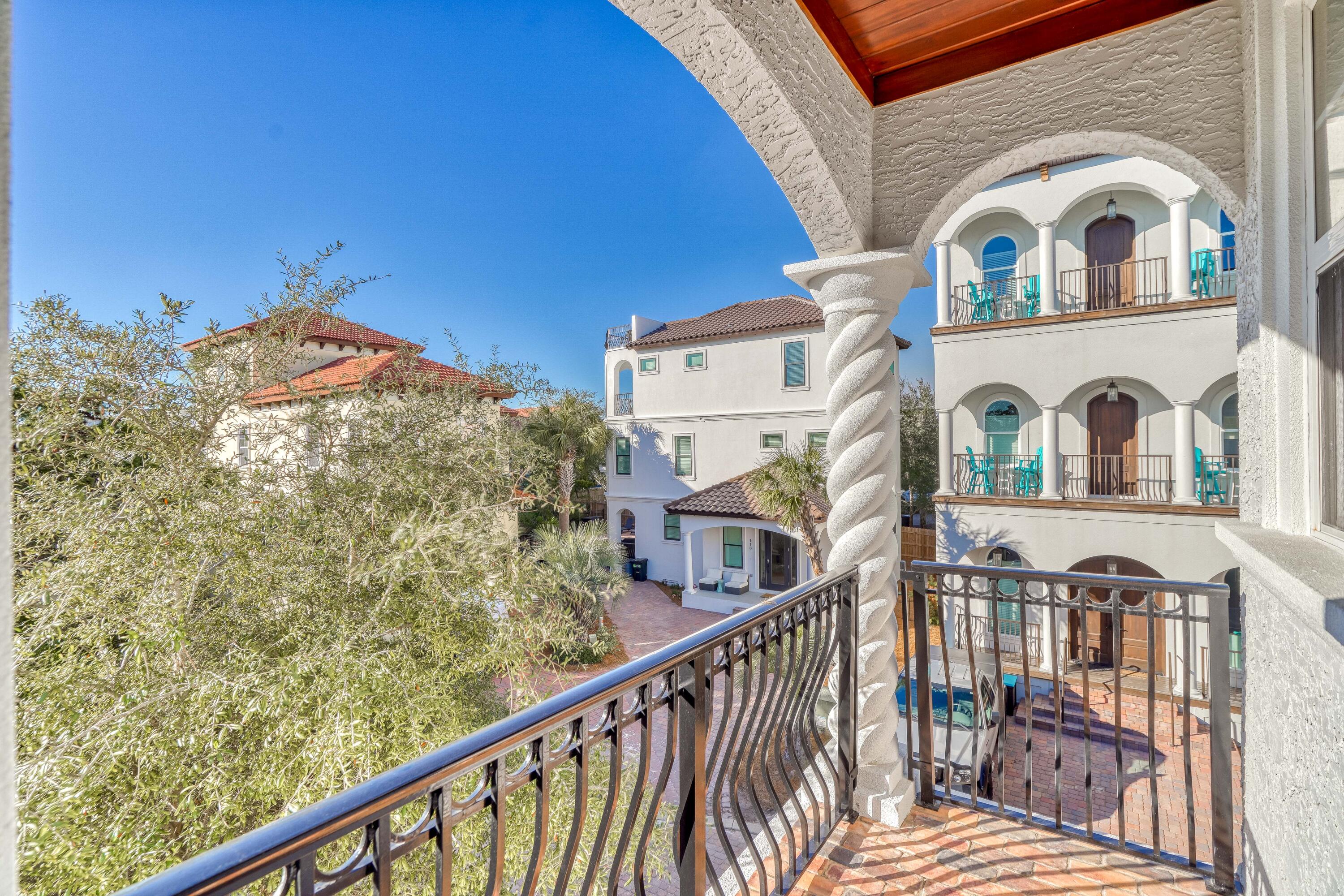 89 Palmeira Way Santa Rosa Beach, FL 32459 - Photo 33 of 64 a view of a brick house with large windows