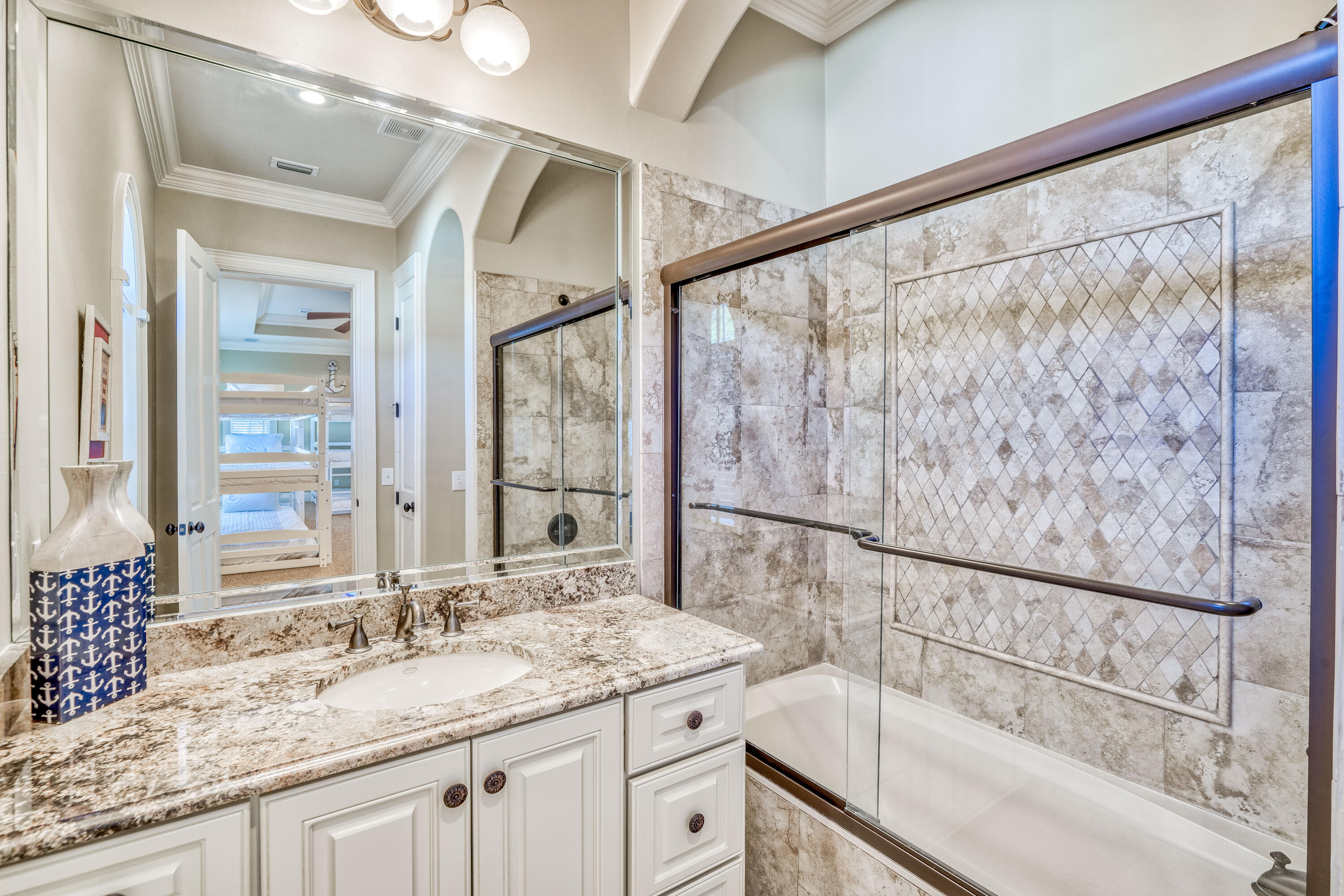 89 Palmeira Way Santa Rosa Beach, FL 32459 - Photo 42 of 64 a bathroom with a granite countertop sink and a mirror