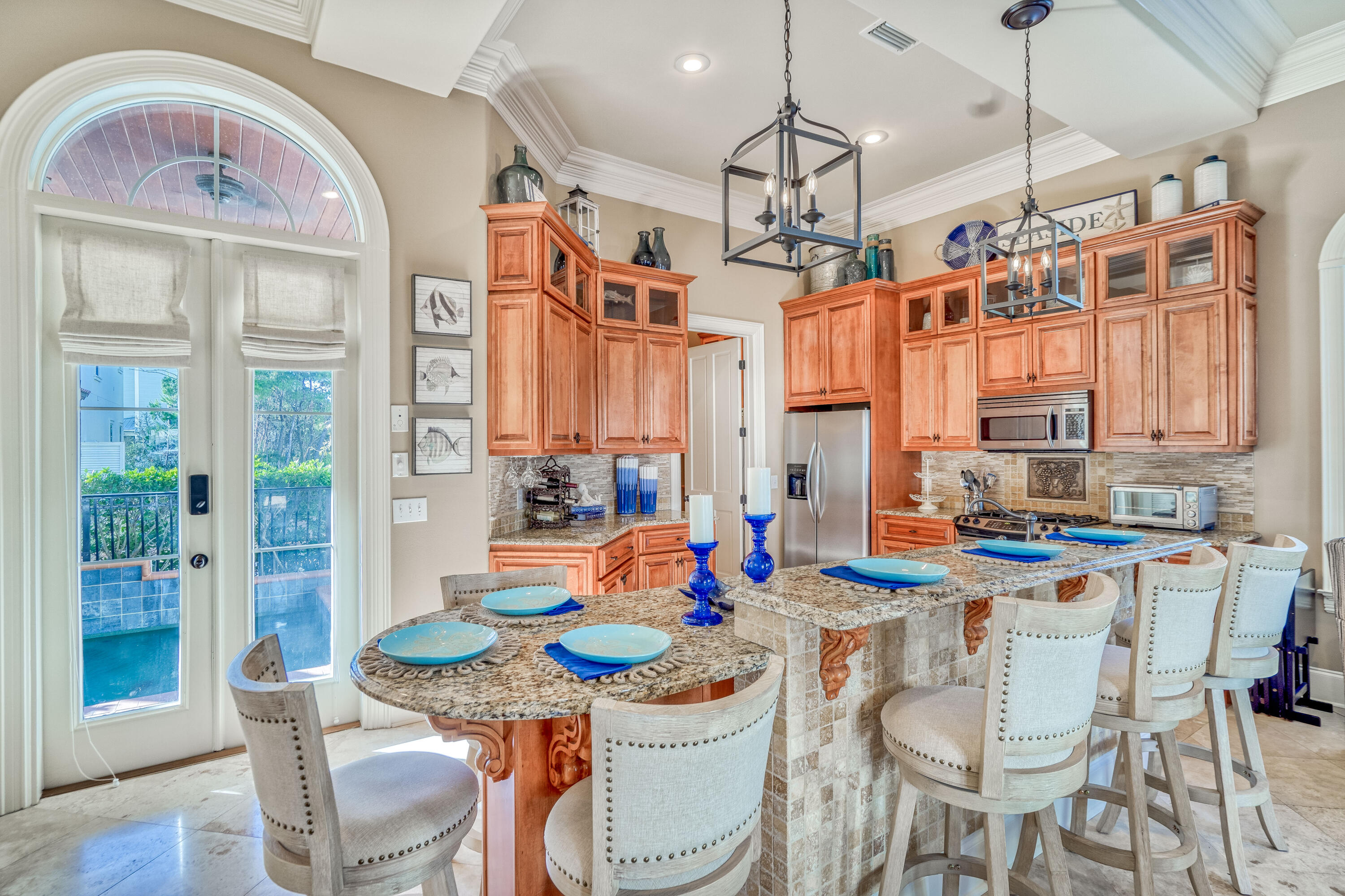 89 Palmeira Way Santa Rosa Beach, FL 32459 - Photo 5 of 64 a dining room with stainless steel appliances kitchen island granite countertop a table and chairs