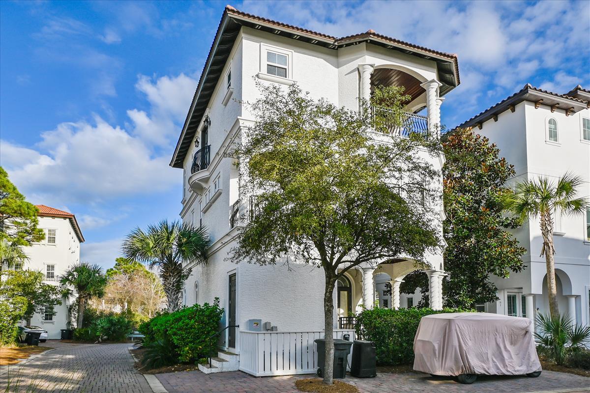 89 Palmeira Way Santa Rosa Beach, FL 32459 - Photo 61 of 64 a front view of a house with garden