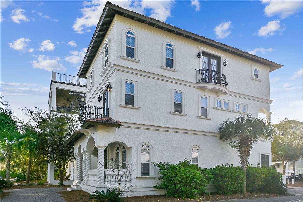 89 Palmeira Way Santa Rosa Beach, FL 32459 - Photo 62 of 64 a front view of a house with garden