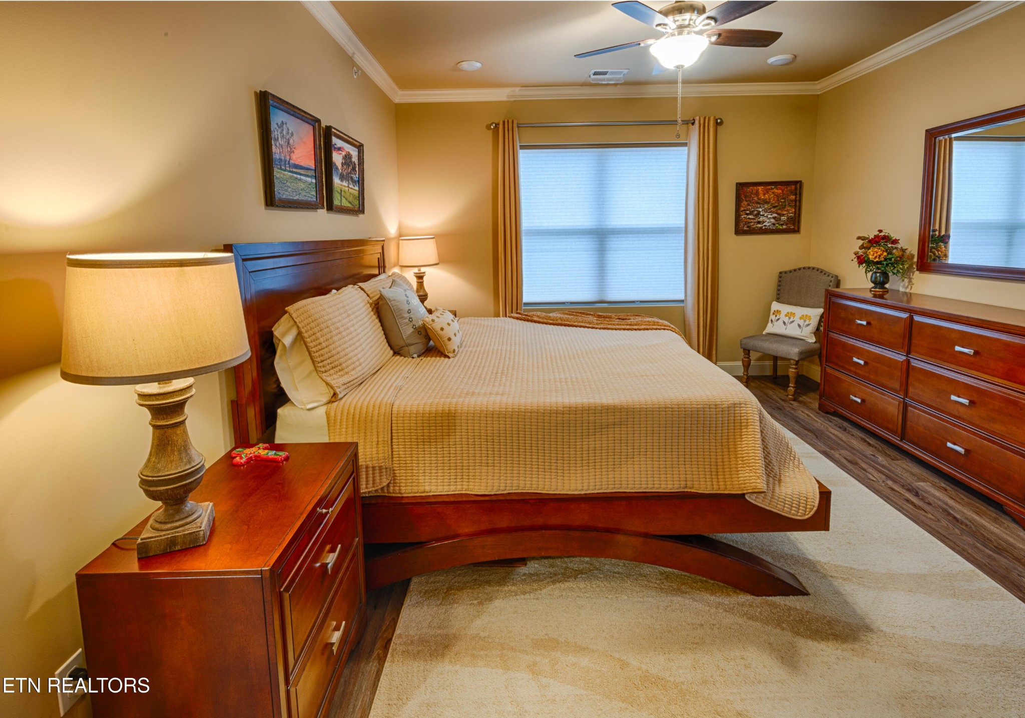 229 Bishops Cap Circle, Unit 101 Townsend, TN 37882 - Photo 18 of 47 a bedroom with a bed and painting on the wall